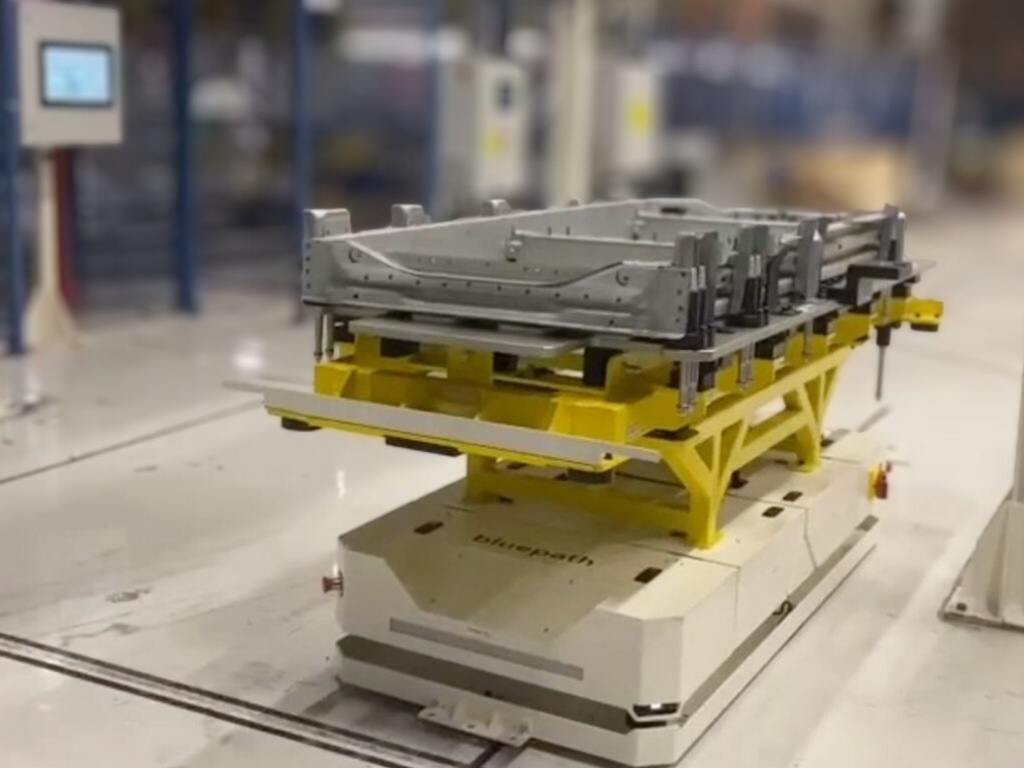 An AGV autonomous robot increasing productivity in an automative factory